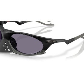 Close-up of black wraparound sport sunglasses with grey lenses, perforated nose bridge detail, and metallic frame arms