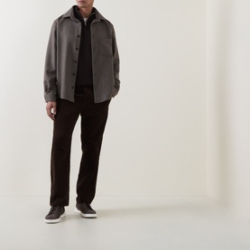 Model wearing Profuomo brown wool-blend casual shirt over black zip-up, styled with dark trousers and grey trainers.