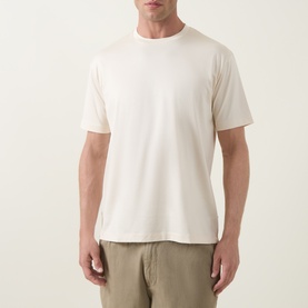 Model wearing Profuomo Solid Logo Pima T-Shirt in Raw White, crew neck, short sleeves, styled with khaki trousers.