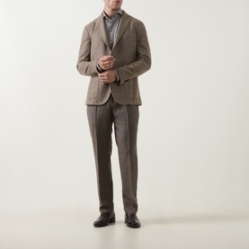 Model wearing Profuomo brown wool-blend trousers, styled with a matching brown blazer and dark grey shirt, black leather shoes.