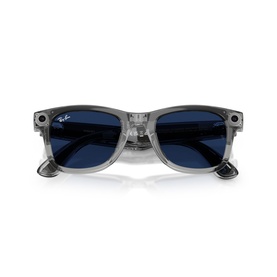 Ray-Ban smart sunglasses with transparent grey frame, dark blue lenses, and integrated technology, folded flat view