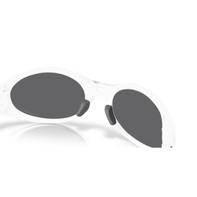 White oval-frame sunglasses with dark grey lenses, shown at an angle highlighting the slim temples and smooth frame finish