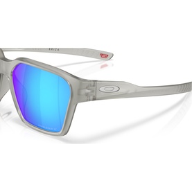 Oakley sunglasses in matte grey with blue mirrored lenses, square frame, silver Oakley logo on temple