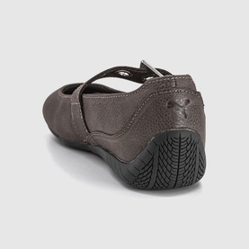Puma matte bronze black women's flat shoe with cross strap, perforated toe box, and black rubber sole, rear angle view.