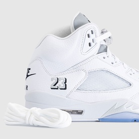 Nike Air Jordan 5 Retro trainer in white with black 23 branding, metallic silver mesh detail, clear sole, and white laces
