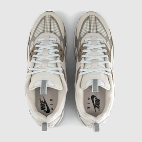 Nike Air trainers in light bone and off-white, overhead flat-lay view, mixed texture uppers with white laces and grey accents