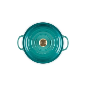 Le Creuset Casserole in Bleu Riviera, viewed from above, with dual handles and gold-tone knob lid detail.