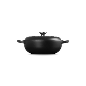 Le Creuset Matte Black cast iron casserole dish with fitted lid and dual handles, wide shallow form