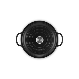 Le Creuset Matte Black cast iron casserole dish, overhead view showing lid with stainless steel knob and twin handles.