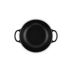 Le Creuset Matte Black casserole dish with two side handles, viewed from above, showing deep rounded interior.
