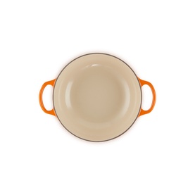 Le Creuset Casserole in Volcanic orange, cream enamel interior, viewed from above showing dual side handles.