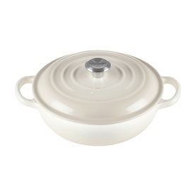 Le Creuset Meringue cast iron shallow casserole dish with domed lid, dual handles, and silver knob finial.