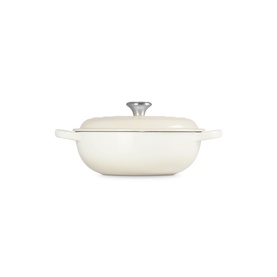 Le Creuset Meringue cast iron casserole dish with lid and silver knob, shallow wide form with side handles.