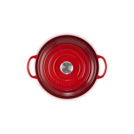 Le Creuset Cerise cast iron round casserole dish, viewed from above, with silver steel knob and twin handles.