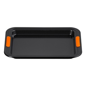 Le Creuset Small Baking Tray 27cm in Satin Black, rectangular non-stick carbon steel with orange silicone handles