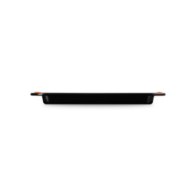 Le Creuset Small Baking Tray 27cm in Satin Black, rectangular non-stick carbon steel with heat-resistant silicone handles, side view