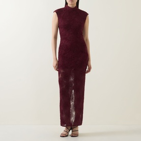Model wearing Rotate Decadent Chocolate lace maxi dress with high neck, cap sleeves and front split, styled with strappy heeled sandals.