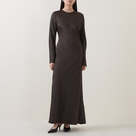 Model wearing Rotate Black Olive maxi dress with long sleeves, crew neck, and fitted silhouette, styled with black heels