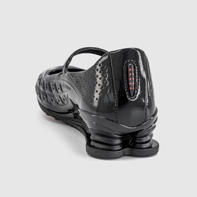 Nike Shox Z Calistra Ballet Flats in black, rear view showing Shox Z cushioning sole, perforated synthetic upper and adjustable strap with hook and