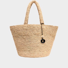 Whistles beige woven raffia tote bag with chunky rope handles and small black charm detail.