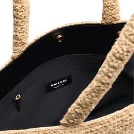 Whistles beige boucl&eacute; tote bag interior view showing black lining, zip pocket, and gold hardware detail on handles.