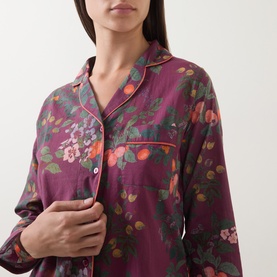 Model wearing Their Nibs plum floral cotton pyjama shirt, close-up showing notch collar, chest pocket and button placket detail