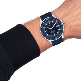 Model with Tommy Hilfiger blue watch, silver-tone case, navy dial, and blue silicone strap