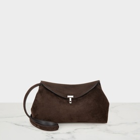 Toteme T-Lock Suede Clutch in brown with silver-tone T-lock clasp, envelope flap, and removable crossbody strap