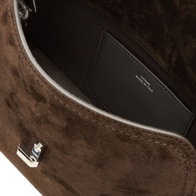 Toteme T-Lock Suede Clutch in brown, open view showing black interior lining and silver-tone T-lock hardware fastening