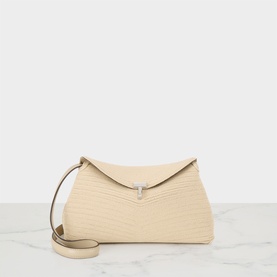 Toteme Pearl clutch bag with structured envelope flap, silver-tone clasp, and slim crossbody strap