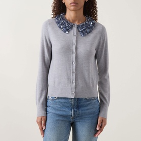 Model wearing Ulla Johnson Anna Embellished Cardigan in ash grey with sequin-embellished collar, styled with blue jeans