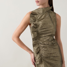 Model wearing Ulla Johnson Demetria Ruched Dress in light gold crinkle taffeta with mock neckline, sleeveless silhouette and ruched bodice detail.