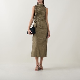 Model wearing Ulla Johnson Demetria Ruched Dress in light gold, midi length with mock neckline and ruched bodice, styled with black clutch and heeled