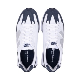 New Balance trainers in white and navy, overhead flat lay showing lace-up detail, grey N logo, and navy rubber sole trim