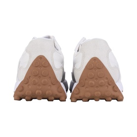 White trainers rear view showing textured gum rubber sole and heel tab detail