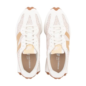 New Balance trainers in white and tan, featuring textured upper, white laces, and gum brown sole, shown from above