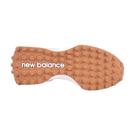 New Balance Golf women's golf shoe sole in White Tan, showing textured tan rubber outsole with New Balance branding.