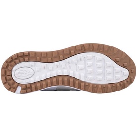New Balance Golf women's golf shoe in Seashell, sole view showing white outsole with tan/gum traction lugs and NB logo.