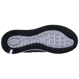 Black and white rubber outsole of a trainer, showing patterned tread and New Balance logo in the heel centre.