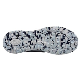 White and navy camouflage-print rubber outsole of a New Balance trainer, showing lug pattern and NB logo