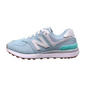 New Balance Golf 574 womens golf shoe in light blue with mint green heel accent, silver N logo, white sole, spikeless outsole