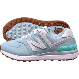 New Balance Golf 574 women's golf shoe in light blue, white and mint, with grey suede overlays and spikeless gum rubber sole.