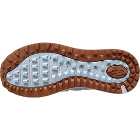New Balance Golf women's golf shoe in light blue, sole view showing tan rubber outsole with multi-directional traction lugs and NB logo.