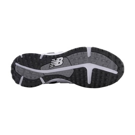 New Balance trainer sole view, black and grey rubber outsole with white NB logo and multi-directional tread pattern