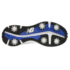 New Balance golf shoe outsole in blue and black with white spiked cleats and NB logo detail.