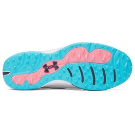 Under Armour trainer sole view showing turquoise and coral rubber outsole with multi-directional traction lugs and navy logo