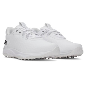 White Under Armour golf shoes with black logo, textured upper, lace-up fastening, and silver spiked outsole, shown as a pair