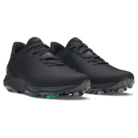 Under Armour golf shoes in black with green heel accent, grey spiked outsole, and tonal lace-up design, shown as a pair