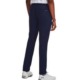 Model wearing Under Armour navy trousers, rear view, tapered fit with elasticated waist, styled with white trainers.