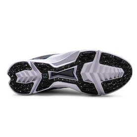 Black and white speckled rubber outsole of a trainer, showing structured tread pattern with grey ridged midsole edges.